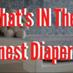 What's IN The Honest diapers?-Change table with soft toy and pile of diapers.