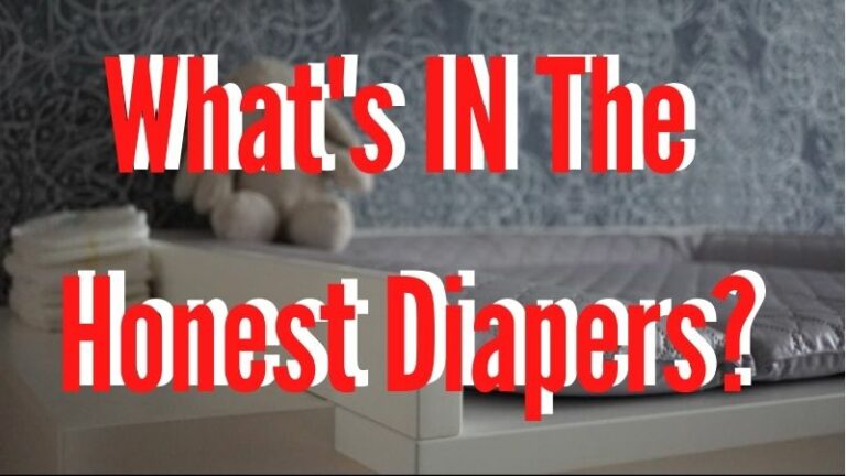 What's IN The Honest diapers?-Change table with soft toy and pile of diapers.