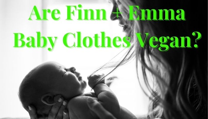 Are Finn Emma baby clothes Vegan?-Baby laying in mother hands holding a strand of her hair.
