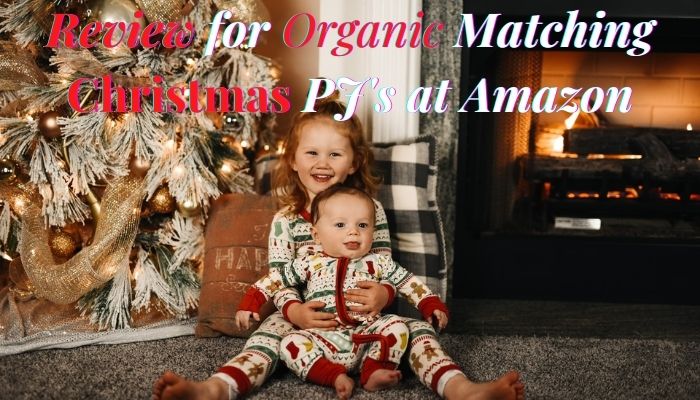 Review for #3 Organic Family Matching Christmas PJ's on Amazon.-Baby and toddler in matching Christmas PJ's before decorated Christmas tree.